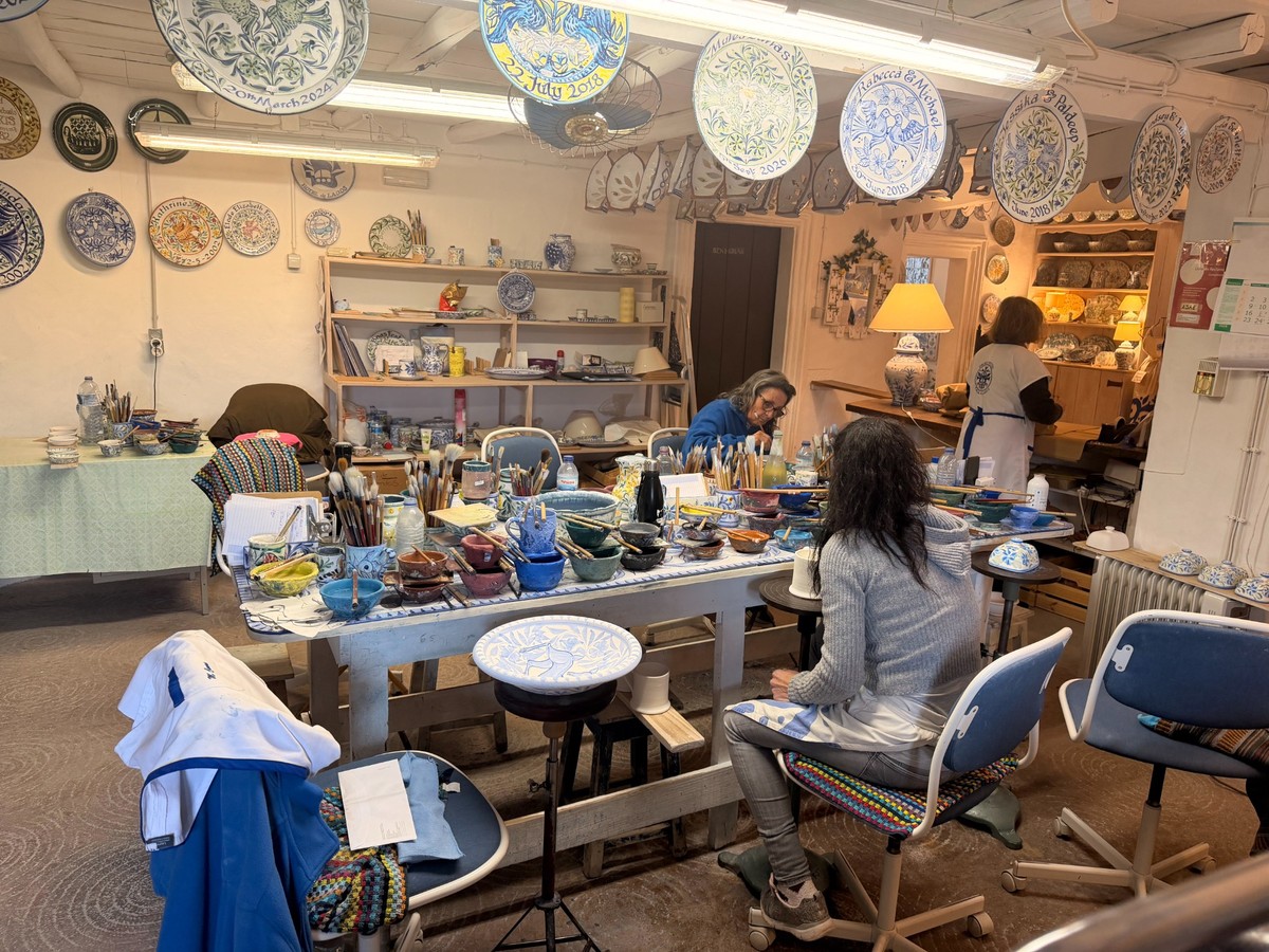 Artisans working in an Algarve pottery studio